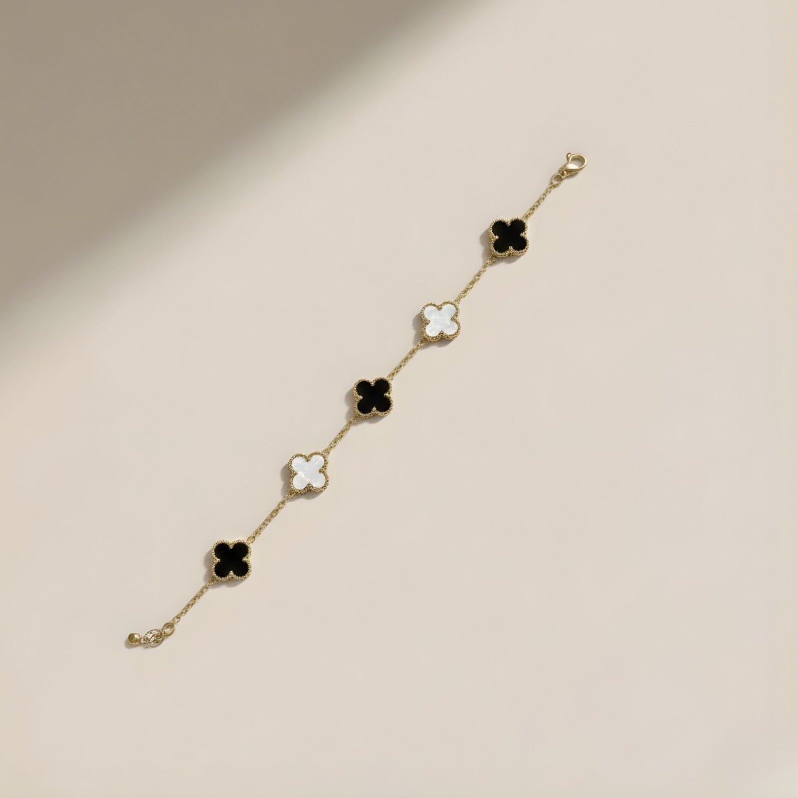 Gold plated anti tarnish black and white clove bracelet